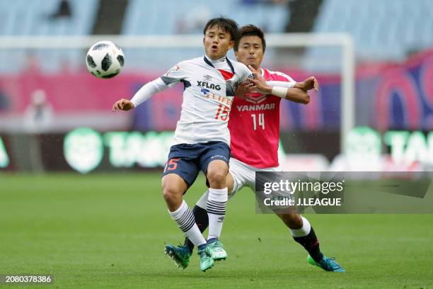 Takefusa Kubo of FC Tokyo controls the ball against Yusuke Maruhashi of Cerezo Osaka during the J.League J1 match between Cerezo Osaka and FC Tokyo...