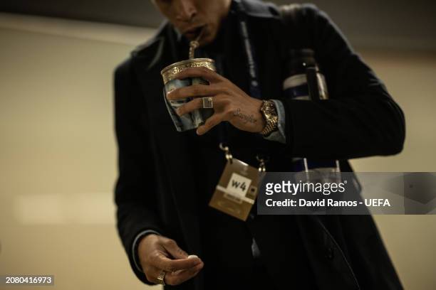 Mathias Olivera of SCC Napoli drinks mate as he arrives at the stadium prior to the UEFA Champions League 2023/24 round of 16 second leg match...