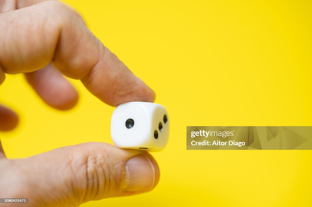 A person plays dice. Random choice