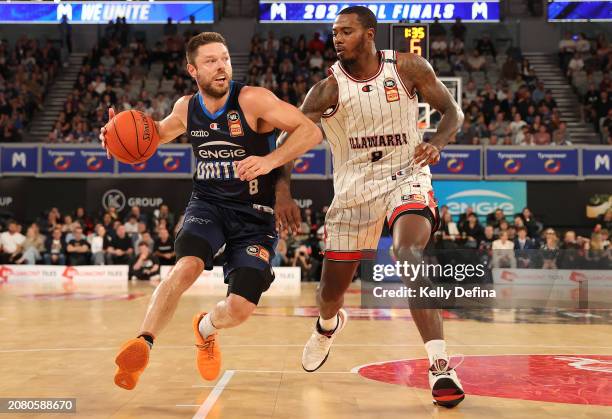 Matthew Dellavedova of United handles the ball against Gary Clark of the Hawks during game three of the NBL Semifinal Playoff Series between...