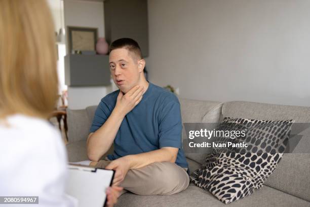 my throat hurts doctor! - hypothyroidism stock pictures, royalty-free photos & images