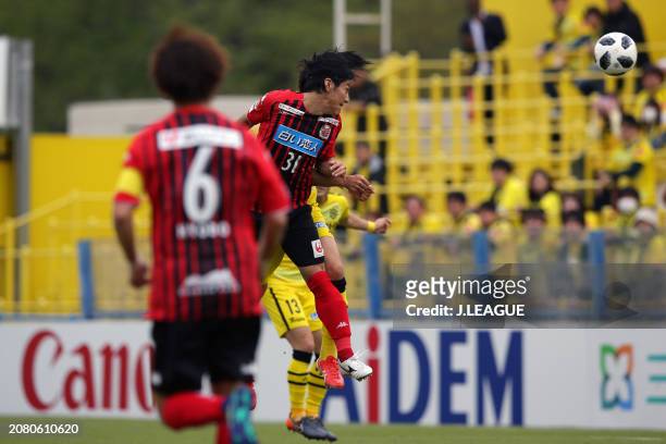 Takumi Miyayoshi of Consadole Sapporo heads to score the team's first goal during the J.League J1 match between Kashiwa Reysol and Hokkaido Consadole...