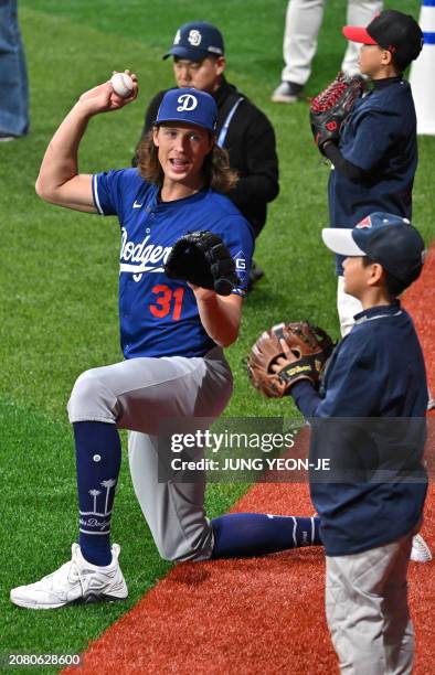 Los Angeles Dodgers' starting pitcher Tyler Glasnow participates in a skills clinic with local youth players during a baseball workout at Gocheok Sky...