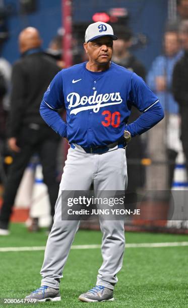 Los Angeles Dodgers manager Dave Roberts stands on the field during a baseball workout at Gocheok Sky Dome in Seoul on March 16 ahead of the 2024 MLB...