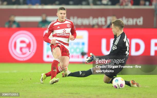Christos Tzolis of Fortuna and Matheo Raab goalkeeper of HSC scores the goal to the 2:0 during the Second Bundesliga match between Fortuna Düsseldorf...