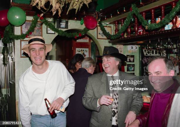 Wimbledon player Vinnie Jones manager Joe Kinnear and kit manager Joe Dillon enjoy themselves at the 1994 Wimbledon FC Christmas Party at Volleys...