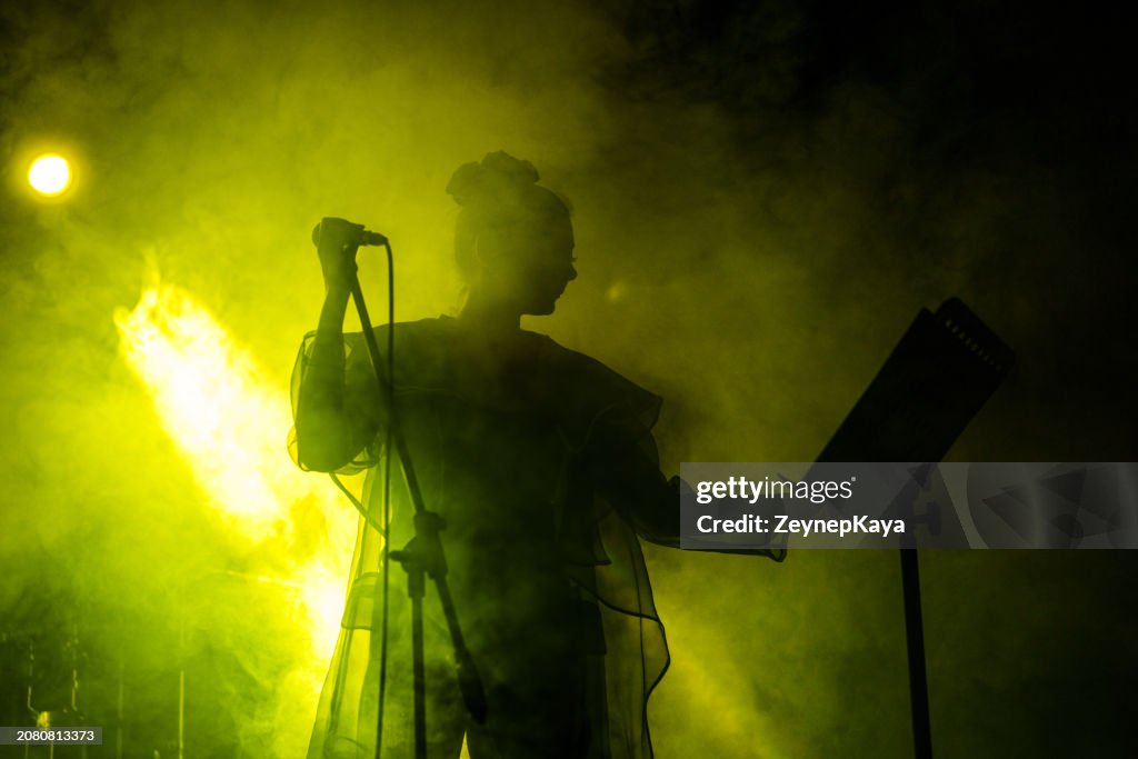 Singer Performing on, stage light and smoke effects.