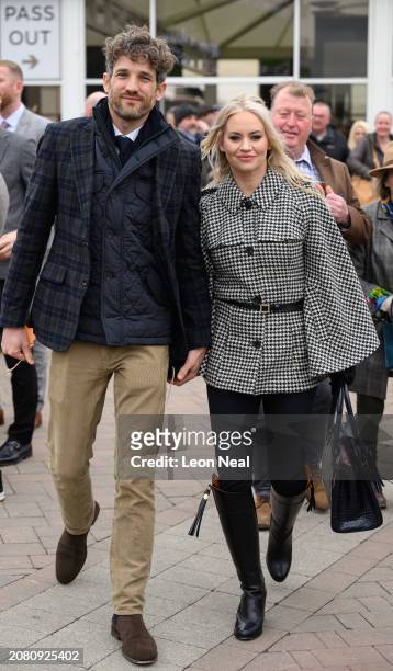 Model Max Rogers and singer Kimberley Wyatt attend Style Wednesday, day two of the Cheltenham Festival at Cheltenham Racecourse on March 13, 2024 in...