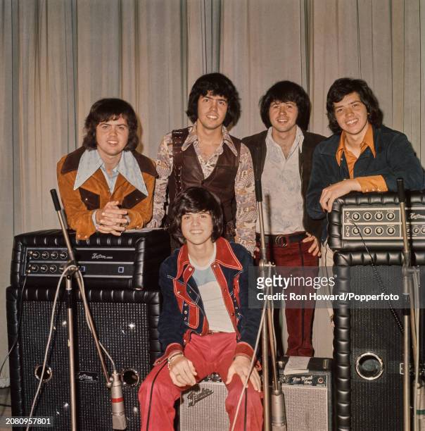 American pop group The Osmonds, comprising Jay Osmond, Alan Osmond, Wayne Osmond, Merrill Osmond and, seated at front, Donny Osmond, posed with...
