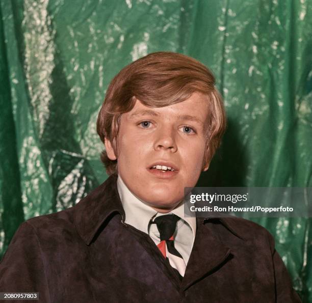 English singer and actor Peter Noone, lead vocalist with pop group Herman's Hermits, posed backstage in London circa 1967.