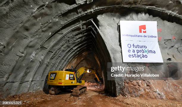 Excavator works with a heavy hammer at opening the tunnel connecting Santos to Rato through new Estrela and Santos stations, that are at an advanced...