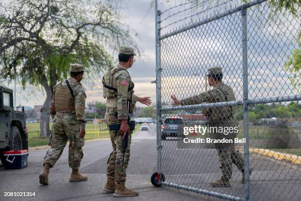 National Guard soldiers patrol at the entrance to Shelby Park on March 12, 2024 in Eagle Pass, Texas. U.S. President Joe Biden's budget proposal...