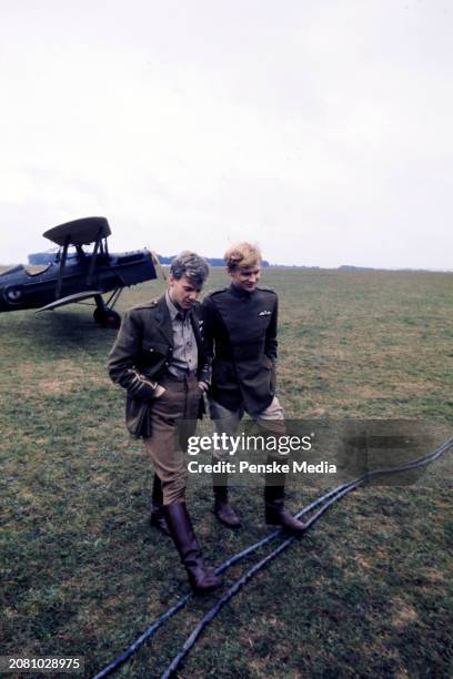 Actors Malcolm McDowell and Peter Firth pose for portraits during an interview on the set of the film, "Aces High," in Wycombe Air Park on September...