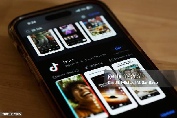 In this photo illustration, the TikTok app is seen in the app store on a phone on March 13, 2024 in New York City. Congress is set to vote and pass a...