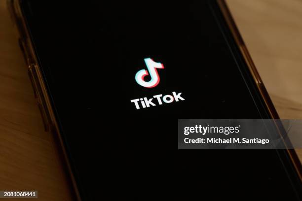 In this photo illustration, the TikTok app is seen on a phone on March 13, 2024 in New York City. Congress is set to vote and pass a bill that could...