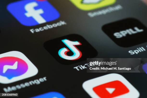 In this photo illustration, the TikTok app is seen on a phone on March 13, 2024 in New York City. Congress is set to vote and pass a bill that could...