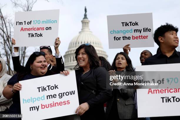 Participants hold signs in support of TikTok outside the U.S. Capitol Building on March 13, 2024 in Washington, DC. The House of Representatives will...