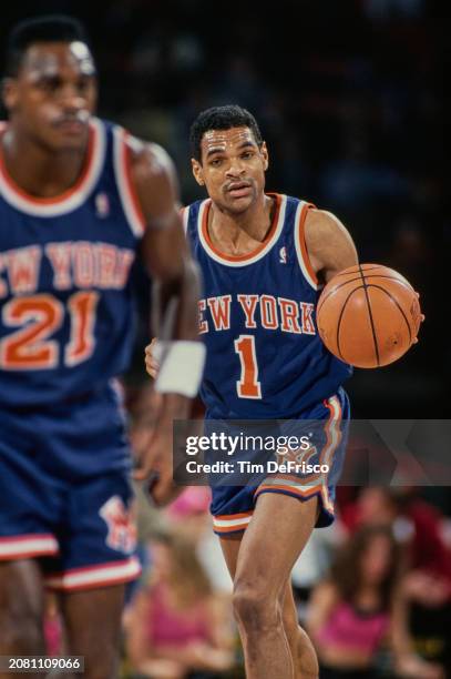 Maurice Cheeks, Point Guard for the New York Knicks in motion dribbling the basketball down court during the NBA Midwest Division basketball game...