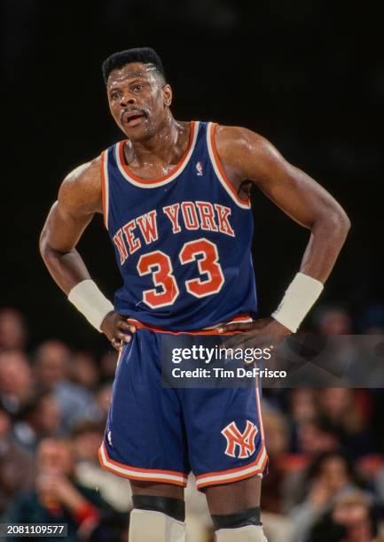 Patrick Ewing, Center and Power Forward for the New York Knicks looks on with hands on hips during the NBA Midwest Division basketball game against...