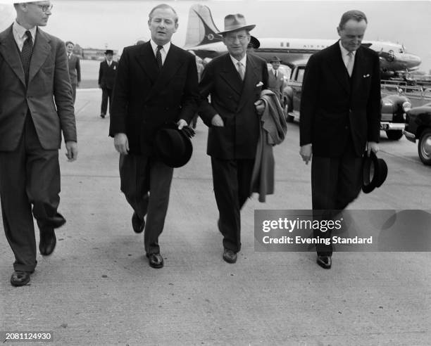 Italian Prime Minister Alcide De Gasperi second right, and British Foreign Secretary Selwyn Lloyd second left, at London Airport, July 16th 1953.