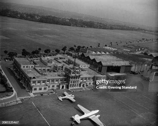 An aerial view of two passenger planes parked in front of Croydon Airport, London, July 21st 1953.