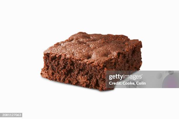 a fudgy brownie on a white surface - caramel block stock pictures, royalty-free photos & images