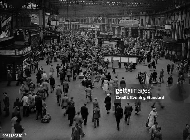 Throng of people passing through Waterloo Station during the bank holiday Monday, London, August 1st 1955.