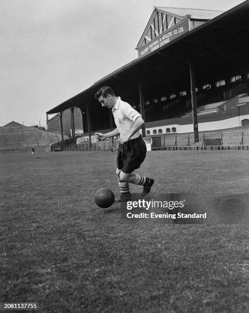 Fulham Football Club striker Johnny Haynes dribbling with a ball during training at Craven Cottage, London, September 23rd 1955.