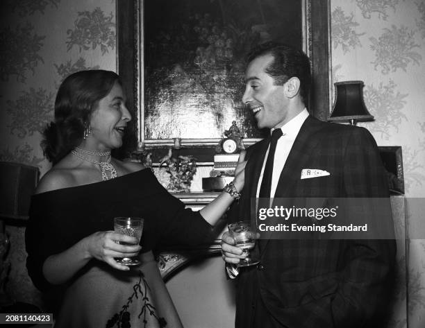 American singer Al Martino with Joyce Wells during a social event, November 2nd 1955.