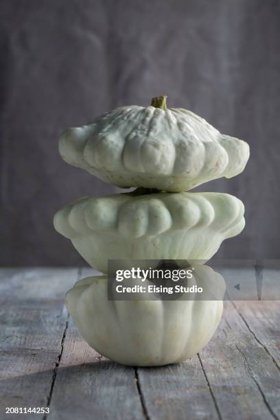 a stack of three patty-pan squash - pattypan squash stock pictures, royalty-free photos & images