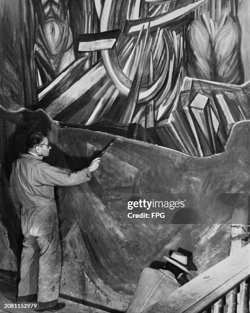 Mexican artist Jose Clemente Orozco at work on his mural titled the 'Four Horsemen of the Apocalypse', at the Temple of Jesus in Mexico City, Mexico,...