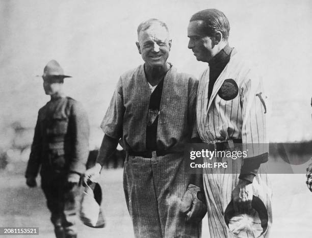 American baseball player and evangelist Billy Sunday and American actor Douglas Fairbanks, both wearing baseball kits, during an exhibition baseball...