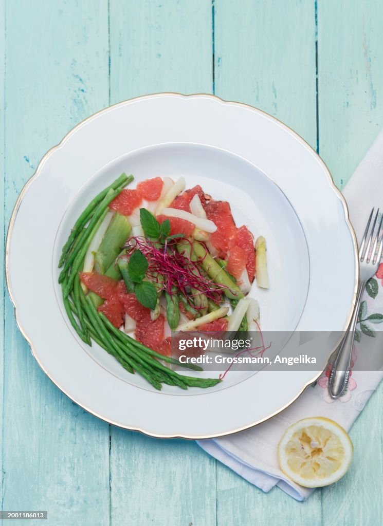 Asparagus salad with grapefruit, fresh mint, beetroot sprouts and lemon