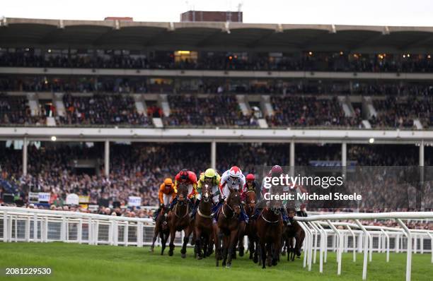 Runners make their way around the course during the Coral Cup Handicap Hurdle during day two of the Cheltenham Festival 2024 at Cheltenham Racecourse...