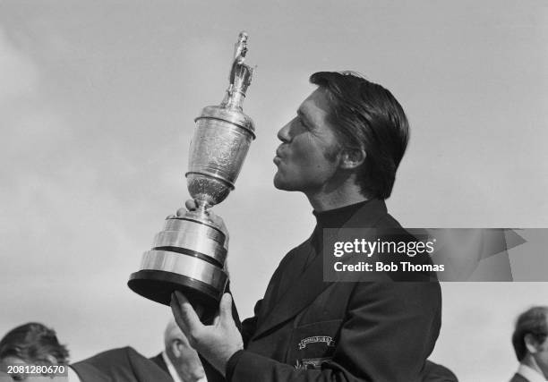 South African golfer Gary Player prepares to kiss the Claret Jug trophy after winning the 1974 British Open Championship at Royal Lytham & St Annes...