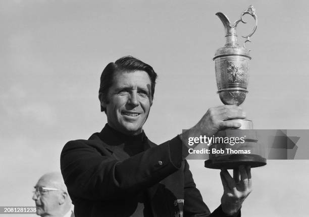 South African golfer Gary Player holds up the Claret Jug trophy after winning the 1974 British Open Championship at Royal Lytham & St Annes Golf Club...