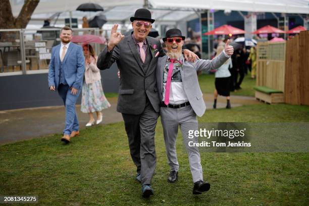 Two stylish racegoers exit the Red Rum Garden before racing on day two, Ladies Day, of the Grand National jump racing festival at Aintree Racecourse...