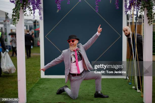Stylish spectator poses before racing on day two, Ladies Day, of the Grand National jump racing festival at Aintree Racecourse on April 14th 2023 in...