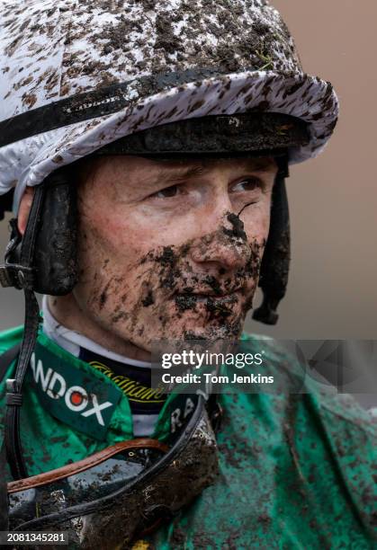 Jockey Sam Twiston-Davies walks back to the weighing room after finishing unplaced on Weveallbeencaught in the Sefton Novices Hurdle race during...