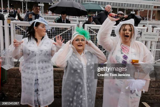 Group of ladies from South Wales cheering on their runners in the first race during racing on day two, Ladies Day, of the Grand National jump racing...