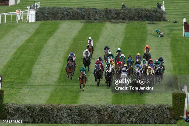 The runners in the Topham Chase progress between The Chair and The Water Jump during racing on day two of the Grand National jump racing festival at...