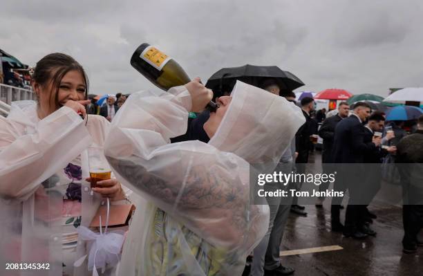 Racegoers enjoying a drink during racing on day two, Ladies Day, of the Grand National jump racing festival at Aintree Racecourse on April 14th 2023...