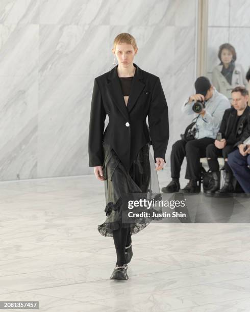 Model walks the runway in a design by MIKAGE SHIN during the Rakuten Fashion Week TOKYO 2024 A/W on March 13, 2024 in Tokyo, Japan.