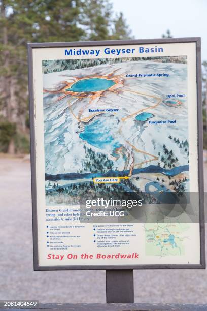 Sign at Midway Geyser Basin shows map of area and instructs visitors to stay on the boardwalk in Yellowstone National Park, Wyoming.