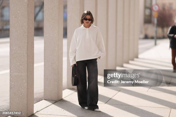 Sophia Geiss seen wearing YSL black sunglasses, COS white cotton buttoned polo sweater, Drykorn grey baggy wide leg denim pants / jeans, Coperni...