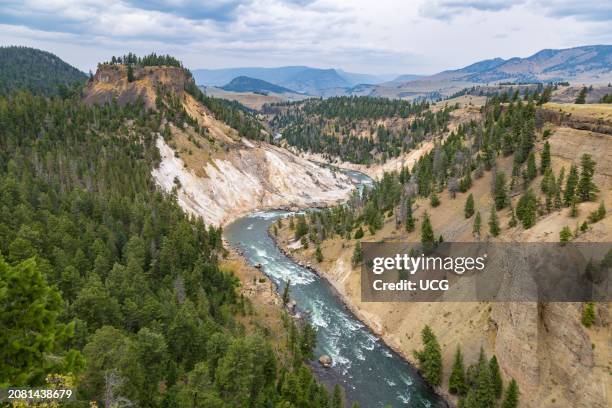 View of the Yellowstone River at the bottom of the Grand Canyon of the Yellowstone from Calcite Springs Overlook in Yellowstone National Park,...