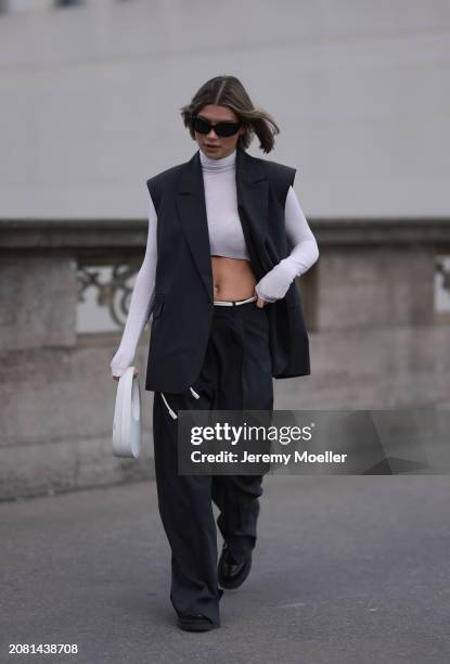 Sophia Geiss seen wearing Mango black sunglasses, Intimissimi white cashmere cropped sheer high neck top, Herskind dark grey suit vest, matching...