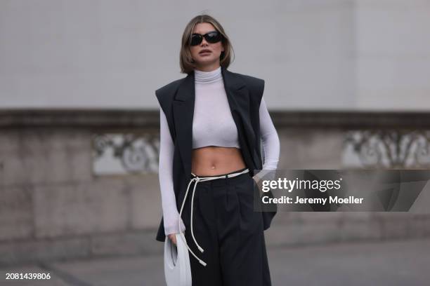 Sophia Geiss seen wearing Mango black sunglasses, Intimissimi white cashmere cropped sheer high neck top, Herskind dark grey suit vest, matching...