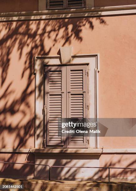 view of residential apartments house and old-fashioned window shutters in bolzano, italy - shutter stock pictures, royalty-free photos & images