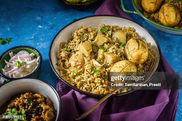 rice biryani with hard-boiled eggs - biriyani stock-fotos und bilder